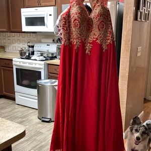 Red gown. 100% polyester hand beaded. Only worn once